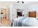 Spacious bedroom features light-colored walls and hardwood floors, with an ensuite bathroom and adjacent living space at 126 Ella Kinley Circle # 401, Myrtle Beach, SC 29588