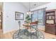 Cozy dining area with a round table, elegant chairs, and a stylish rug beneath a modern chandelier at 126 Ella Kinley Circle # 401, Myrtle Beach, SC 29588