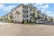 Beautiful condo buildings featuring well-kept landscaping, spacious balconies, and ample parking at 126 Ella Kinley Circle # 401, Myrtle Beach, SC 29588