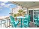 Inviting balcony with cozy seating, overlooking the ocean and beach for a serene getaway experience at 1310 N Waccamaw Dr. # 211, Garden City Beach, SC 29576