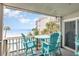 Comfortable balcony with seating offers ocean views, ideal for relaxing and enjoying the beach atmosphere at 1310 N Waccamaw Dr. # 211, Garden City Beach, SC 29576