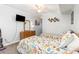 Bright bedroom featuring two beds with matching nautical bedding, a TV, and light blue walls at 1310 N Waccamaw Dr. # 211, Garden City Beach, SC 29576