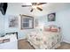 Nautical themed bedroom features a decorative bedspread, ceiling fan, and charming artwork at 1310 N Waccamaw Dr. # 211, Garden City Beach, SC 29576