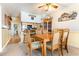 Comfortable dining area with wooden table and chairs, open to the kitchen at 1310 N Waccamaw Dr. # 211, Garden City Beach, SC 29576