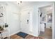 Bright entryway with tile flooring and a view into the living area at 1310 N Waccamaw Dr. # 211, Garden City Beach, SC 29576