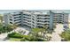 Condo complex with parking, landscaping, and multiple floors of residences near the ocean at 1310 N Waccamaw Dr. # 211, Garden City Beach, SC 29576