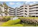 Beautifully landscaped condo complex with mature plants and views from multiple levels at 1310 N Waccamaw Dr. # 211, Garden City Beach, SC 29576