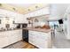 Functional kitchen with white cabinetry, updated appliances, and an open layout at 1310 N Waccamaw Dr. # 211, Garden City Beach, SC 29576