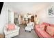 Cozy living room with neutral carpet and decor that flows into dining area at 1310 N Waccamaw Dr. # 211, Garden City Beach, SC 29576