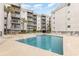 Inviting pool area with ample lounge chairs, perfect for relaxing and enjoying sunny days near the beach at 1310 N Waccamaw Dr. # 211, Garden City Beach, SC 29576