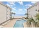 Enjoy a stunning pool view from this condo, complete with lounge chairs and easy beach access at 1310 N Waccamaw Dr. # 211, Garden City Beach, SC 29576
