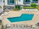 Picturesque pool area with nearby beach access, perfect for relaxation and enjoyment, featuring lounge chairs at 1310 N Waccamaw Dr. # 211, Garden City Beach, SC 29576