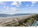 Stunning beach aerial view with ocean, beach, and palm trees at 2000 Ocean Blvd. N # 216, Myrtle Beach, SC 29588