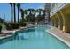 Enjoy a refreshing dip in this outdoor pool surrounded by palm trees and lounge chairs at 2000 Ocean Blvd. N # 216, Myrtle Beach, SC 29588