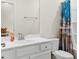 Bathroom with bright white vanity, a mirror, and decorative shower curtain at 2250 Heritage Loop, Myrtle Beach, SC 29577