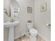 Powder room featuring pedestal sink and commode with unique plank flooring at 2250 Heritage Loop, Myrtle Beach, SC 29577