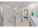 Bright bathroom featuring a shower with a glass door, a tub, and a vanity at 2250 Heritage Loop, Myrtle Beach, SC 29577