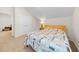 Serene bedroom with slanted ceilings, a bed with patterned quilt, and a view into another room at 2250 Heritage Loop, Myrtle Beach, SC 29577