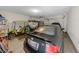 Spacious garage with two golf carts, a black vehicle, and ample storage space at 2250 Heritage Loop, Myrtle Beach, SC 29577