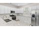 Well-equipped kitchen with stainless steel appliances, white cabinets, and granite countertops at 2250 Heritage Loop, Myrtle Beach, SC 29577