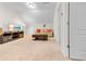 Cozy living room with plush carpeting, comfortable seating, and a modern entertainment center at 2250 Heritage Loop, Myrtle Beach, SC 29577