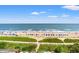 Beach scene with beachgoers and colorful umbrellas at 3000 N Ocean Blvd. # 729, Myrtle Beach, SC 29577