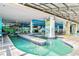 Charming indoor lazy river with tiled accents, murals, and a translucent roof allowing natural light at 3000 N Ocean Blvd. # 729, Myrtle Beach, SC 29577