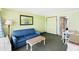 A well lit living room with blue furniture, dining table, and decor at 3000 N Ocean Blvd. # 729, Myrtle Beach, SC 29577