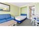 Cozy space with a comfy sofa, bed, dining table, and a view from the balcony at 3000 N Ocean Blvd. # 729, Myrtle Beach, SC 29577