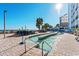 Inviting pool and lazy river with lounge seating, palm trees, and a convenient poolside bar at 3000 N Ocean Blvd. # 729, Myrtle Beach, SC 29577