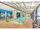 Inviting indoor pool area with brick trim, murals, and a translucent roof providing natural light at 3000 N Ocean Blvd. # 729, Myrtle Beach, SC 29577
