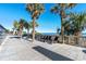 Serene wooden deck with lounge chairs and tropical palms, offering ocean views at 3000 N Ocean Blvd. # 729, Myrtle Beach, SC 29577