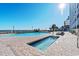 Relaxing outdoor pool and hot tub surrounded by brick pavers and lounge chairs with ocean views at 3000 N Ocean Blvd. # 729, Myrtle Beach, SC 29577