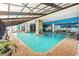 Bright, indoor pool area with brick trim, murals, and a translucent roof letting in natural light at 3000 N Ocean Blvd. # 729, Myrtle Beach, SC 29577