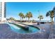 Picturesque lazy river with palm trees and lounge chairs offering a tranquil outdoor experience at 3000 N Ocean Blvd. # 729, Myrtle Beach, SC 29577