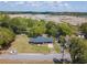 Aerial view of the home showcasing its location with pond, mature trees, and proximity to waterways at 391 Waterford Dr., Georgetown, SC 29440