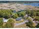 The aerial view showcases the home's secluded pond, proximity to the water, and the neighborhood at 391 Waterford Dr., Georgetown, SC 29440