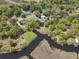 The aerial view captures the home's secluded pond, proximity to the water, and the neighborhood at 391 Waterford Dr., Georgetown, SC 29440