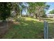 Large backyard with mature trees providing ample shade, partially fenced and very private at 391 Waterford Dr., Georgetown, SC 29440