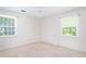 A basic bedroom featuring two bright windows and a ceiling fan at 391 Waterford Dr., Georgetown, SC 29440