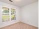Bright bedroom with carpeted floors and a large window, providing natural light at 391 Waterford Dr., Georgetown, SC 29440