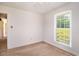 Neutral bedroom with carpeted floors, a ceiling fan, and natural light from the window at 391 Waterford Dr., Georgetown, SC 29440