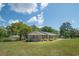 Lovely brick ranch home with mature landscaping and a view of the serene pond at 391 Waterford Dr., Georgetown, SC 29440
