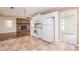 Open-concept kitchen showcasing brick fireplace and traditional appliances at 391 Waterford Dr., Georgetown, SC 29440