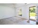 Bright living room with neutral carpet and large window with natural light at 391 Waterford Dr., Georgetown, SC 29440
