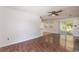 Cozy living space with wood floors, sliders to a porch, and connecting to the kitchen at 391 Waterford Dr., Georgetown, SC 29440