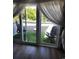 Balcony with glass doors and astroturf, viewed from the bedroom at 4701 N Kings Hwy. # 19, Myrtle Beach, SC 29579