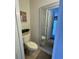 Toilet room with small decorative plants and light brown flooring with neutral walls at 4701 N Kings Hwy. # 19, Myrtle Beach, SC 29579