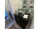 Modern bathroom featuring a glass bowl sink, black vanity, and decorative accents at 4701 N Kings Hwy. # 19, Myrtle Beach, SC 29579