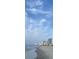 Oceanfront view of beach and buildings with expansive blue sky at 4701 N Kings Hwy. # 19, Myrtle Beach, SC 29579
